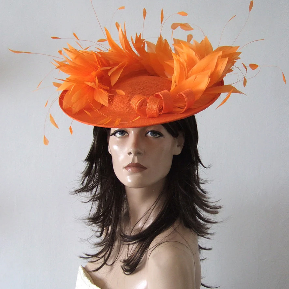 Jaffa Orange Hat for Royal Ascot. Hats for Royal Ascot. Orange Mother of the Bride hats. Orange Hat for Mother of the Bride. Designer Hat for Royal Ascot. Orange Hat for Wedding Guest. What to wear for Royal Ascot Races. Orange Fascinator.