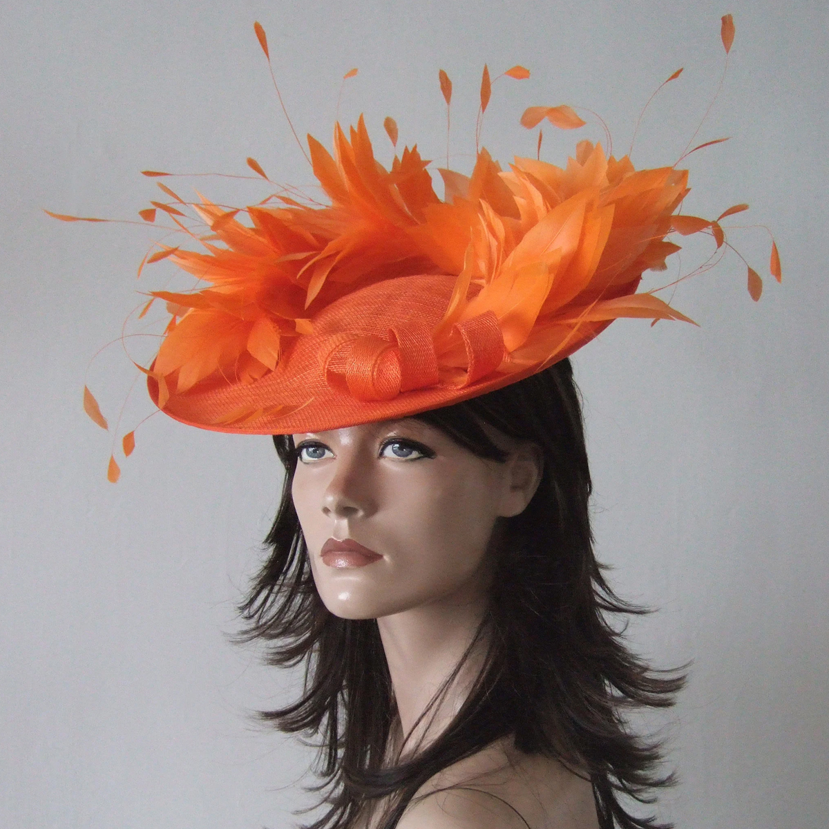 Jaffa Orange Hat for Royal Ascot. Hats for Royal Ascot. Orange Mother of the Bride hats. Orange Hat for Mother of the Bride. Designer Hat for Royal Ascot. Orange Hat for Wedding Guest. What to wear for Royal Ascot Races. Orange Fascinator.