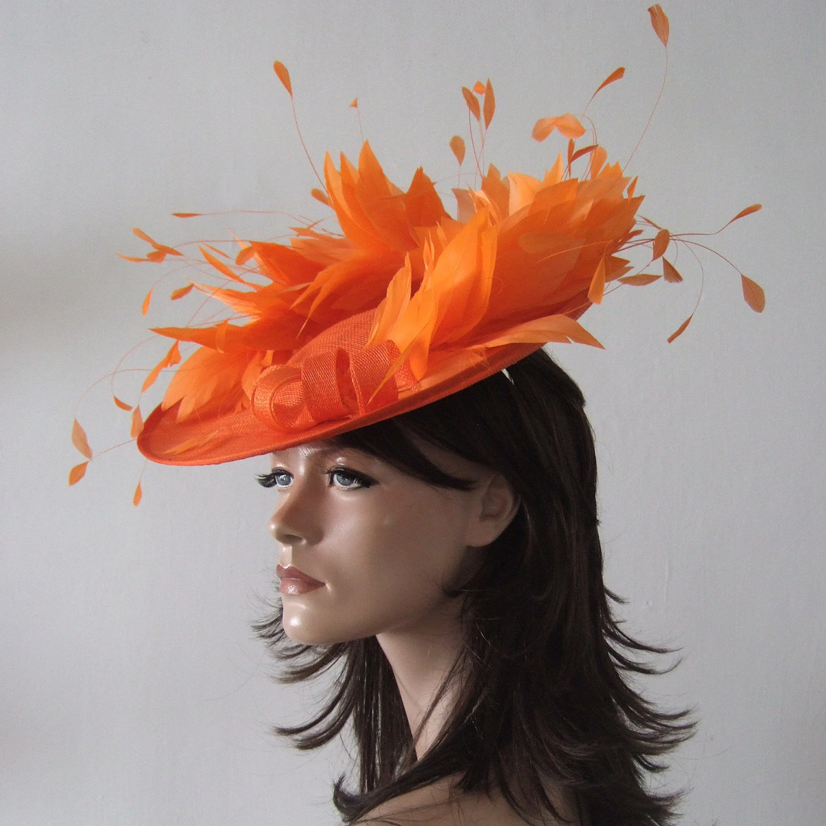 Jaffa Orange Hat for Royal Ascot. Hats for Royal Ascot. Orange Mother of the Bride hats. Orange Hat for Mother of the Bride. Designer Hat for Royal Ascot. Orange Hat for Wedding Guest. What to wear for Royal Ascot Races. Orange Fascinator.