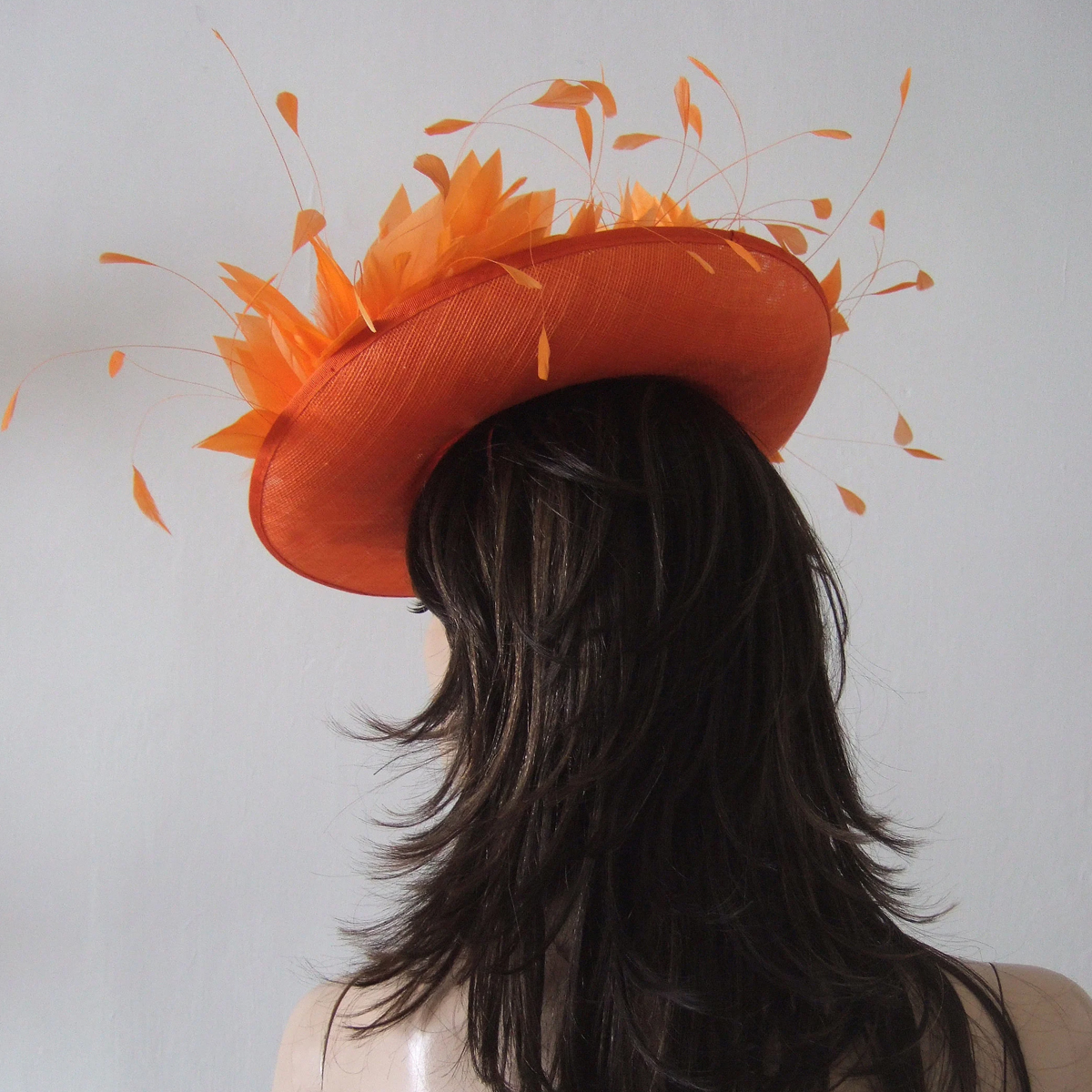 Jaffa Orange Hat for Royal Ascot. Hats for Royal Ascot. Orange Mother of the Bride hats. Orange Hat for Mother of the Bride. Designer Hat for Royal Ascot. Orange Hat for Wedding Guest. What to wear for Royal Ascot Races. Orange Fascinator.