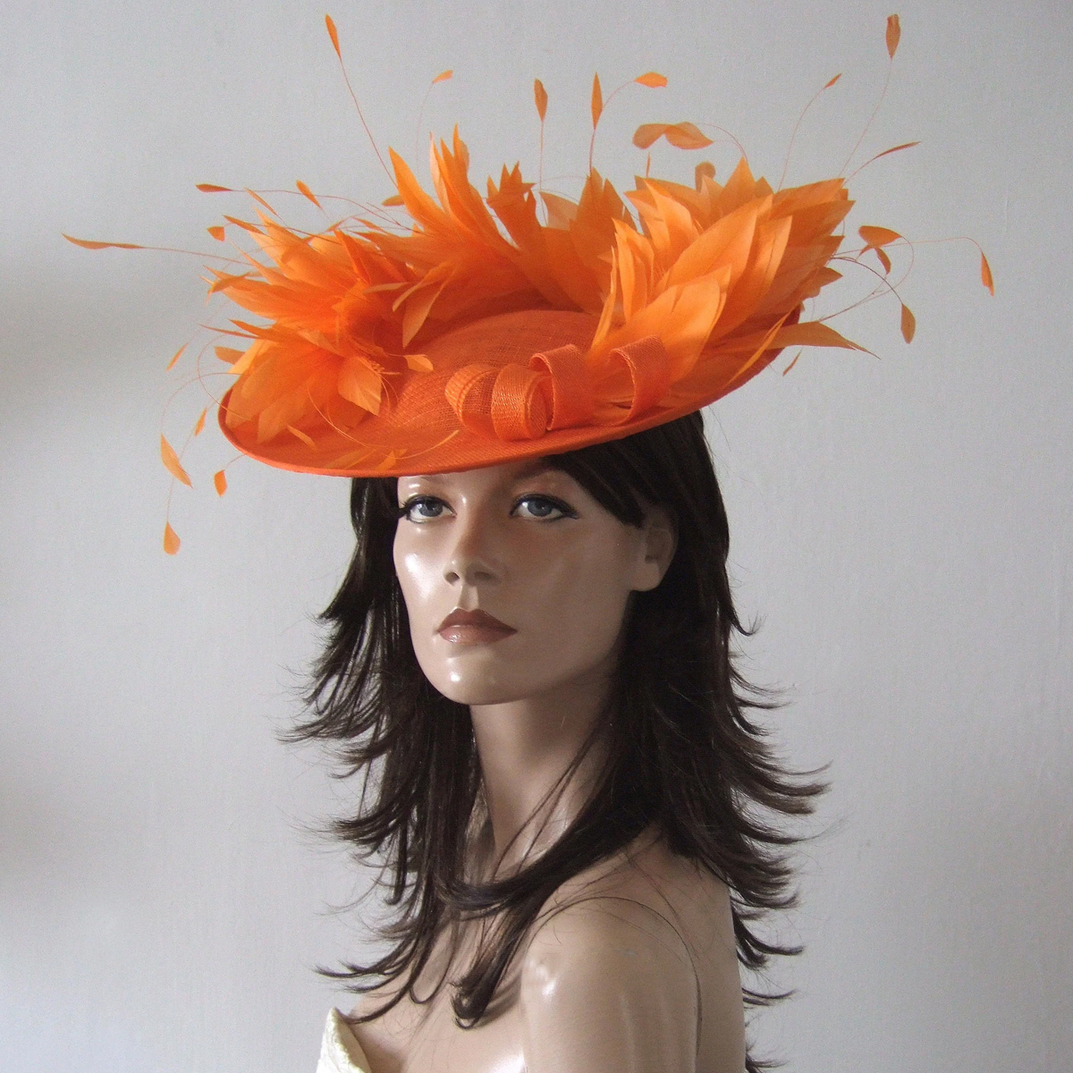 Jaffa Orange Hat for Royal Ascot. Hats for Royal Ascot. Orange Mother of the Bride hats. Orange Hat for Mother of the Bride. Designer Hat for Royal Ascot. Orange Hat for Wedding Guest. What to wear for Royal Ascot Races. Orange Fascinator.
